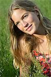 Young woman daydreaming outdoors, portrait