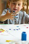 Little boy finger painting