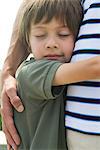 Boy embracing his father, close-up