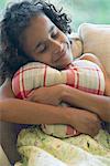 Girl hugging pillow