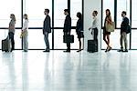 Business people standing in line