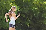 Young Women Jogging Outdoor in the Sunny Day