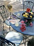 Garden table with hibiscus flowers and fruit bowl