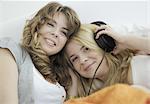Two young women listening to music