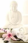 Buddha statuette with blossoms and hematite