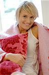 Smiling young woman at home