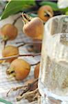 Wild apples with glass of water