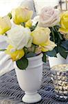 Flower vase with yellow and white roses