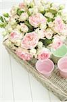 Bunch of flowers and cups on tray