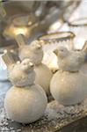 Bird figurines on artificial eggs