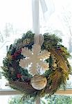 Christmas wreath hanging at window