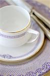 Place setting with cup, saucer, plate and cutlery