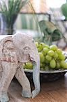 Elephant figurine and grapes