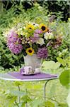 Colorful bunch of flowers on garden table