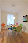 Dining room with colorful chairs