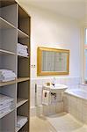 Bathroom with towels in shelf