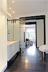 Modern bathroom with passage to open plan kitchen