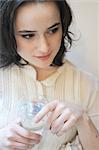 Young woman drinking glass of water