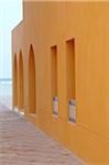 Detail of a house, walkway and ocean