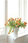 Bunch of tulips in windowsill