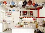 Country kitchen with sifters on the ceiling