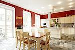 Open plan kitchen with dining area and tiled floor