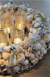 Wreath made of snail shells and candles