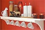 Kitchen shelf with cups and decorative objects