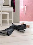 Jeans and womens shoes on wooden floor