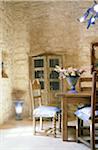 Dining area in a house with stone wall