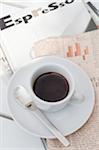 Espresso and newspaper