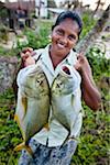 Woman Holding Freshly Caught Fish, Ahangama, Sri Lanka