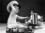 1940s BABY IN DIAPER WITH SHIP CAPTAIN HAT SEXTANT AND NAUTICAL COMPASS