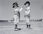 1960s BOY LITTLE LEAGUER PITCHER ARGUING WITH CATCHER