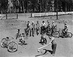 1950s - 10 NEIGHBORHOOD BOYS PLAYING SAND LOT BASEBALL MOST WEAR BLUE JEANS TEE SHIRTS