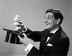 1960s PROFILE MAGICIAN MAN PULLING 4 EGGS OUT OF HAT HOLDING THEM BETWEEN FINGERS