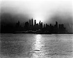 1930s - 1940s EARLY MORNING MISTY SUNRISE NEW YORK CITY WITH TUG BOAT BARGE IN HUDSON RIVER