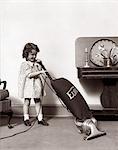 1930s LITTLE GIRL VACUUMING WITH EUREKA ELECTRIC VACUUM CLEANER