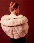 1970s ELEGANT UPSCALE WOMAN BACK VIEW WEARING SILVER FUR STOLE COAT