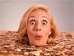 1960s SILLY WACKY EXPRESSION ON FUNNY WOMAN UP TO NECK IN COINS AND CURRENCY DROWNING IN LUCK