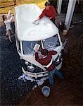 1970s TWO TEENAGE BOYS AND GIRL WASHING A VOLKSWAGEN VAN AUTOMOBILE