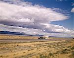 1970s STATION WAGON PULLING RV CAMPER INTERSTATE 80 NEAR WINNEMUCCA NEVADA