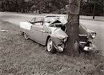 1950s CONVERTIBLE CRASHED HEAD-ON INTO A TREE OUTDOOR