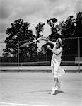 1930s WOMAN PLAYING TENNIS ACTION