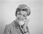 1960s PORTRAIT SMILING WOMAN TALKING ON TELEPHONE