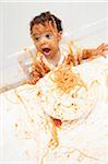 Boy eating Spaghetti with Hands