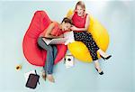 Businesswomen laughing in bean bags