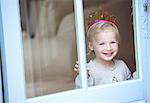 Smiling toddler girl wearing tiara