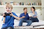 Boy playing video games in living room