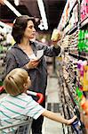 Woman grocery shopping with son